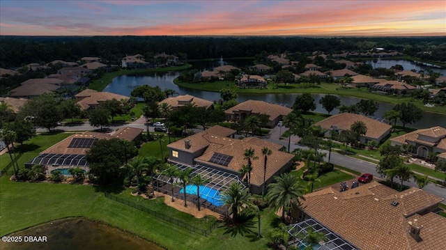 aerial view at dusk with a water view