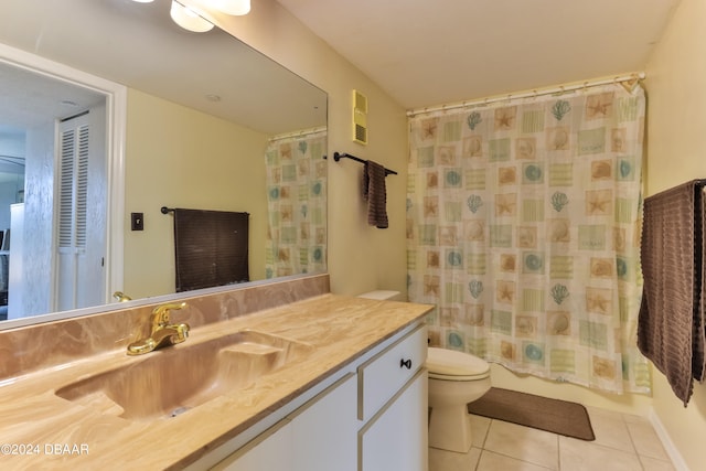 full bathroom featuring shower / bath combo, tile patterned flooring, vanity, and toilet