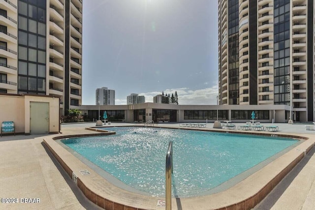 view of swimming pool with a patio area