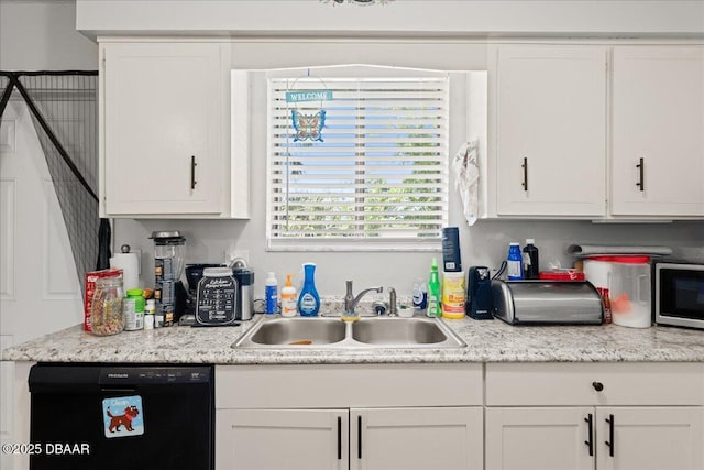 kitchen featuring light countertops, black dishwasher, white cabinets, and a sink