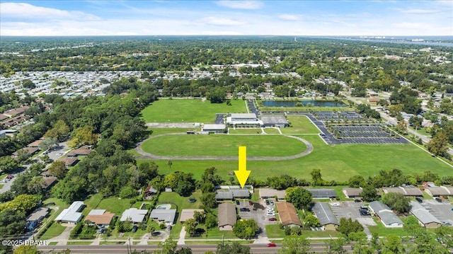 birds eye view of property with a water view and a residential view