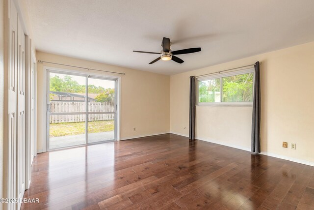 73 N St Andrews Dr, Ormond Beach, FL 32174 - spare room featuring ceiling fan, dark wood-style floors, and baseboards