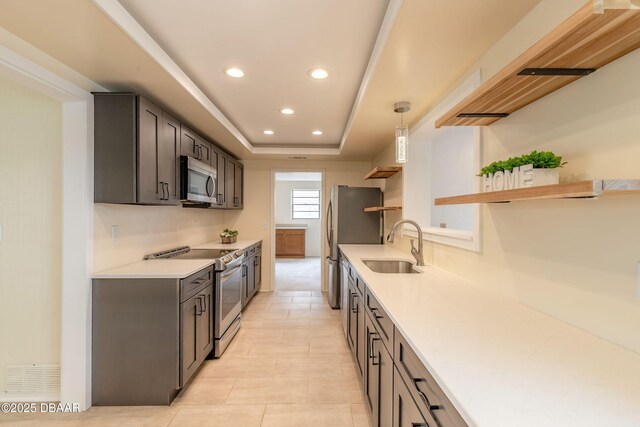 73 N St Andrews Dr, Ormond Beach, FL 32174 - kitchen with stainless steel appliances, open shelves, a sink, recessed lighting, and light countertops