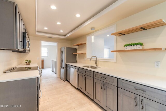 73 N St Andrews Dr, Ormond Beach, FL 32174 - kitchen featuring a sink, open shelves, stainless steel appliances, washer / clothes dryer, and recessed lighting