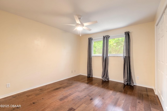 73 N St Andrews Dr, Ormond Beach, FL 32174 - empty room with dark wood-type flooring, a ceiling fan, and baseboards