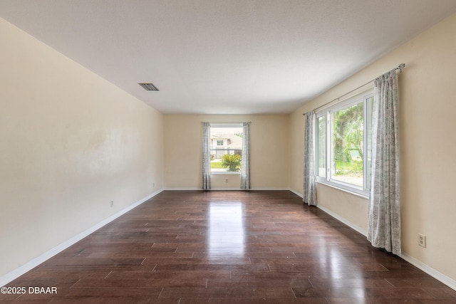 73 N St Andrews Dr, Ormond Beach, FL 32174 - empty room with dark wood finished floors and baseboards
