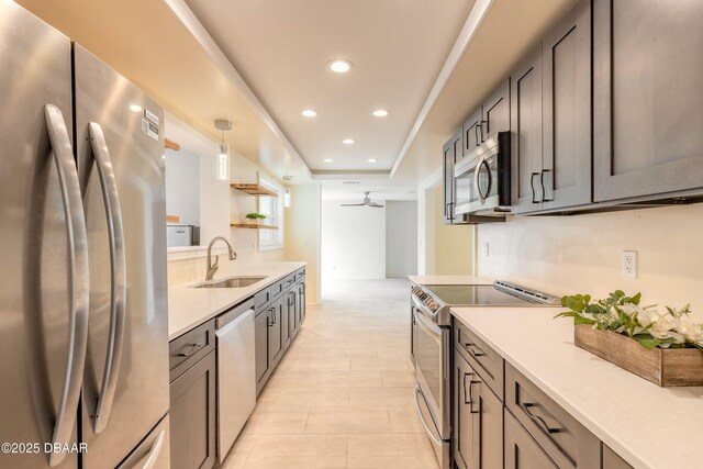 73 N St Andrews Dr, Ormond Beach, FL 32174 - kitchen featuring stainless steel appliances, a sink, light countertops, recessed lighting, and ceiling fan