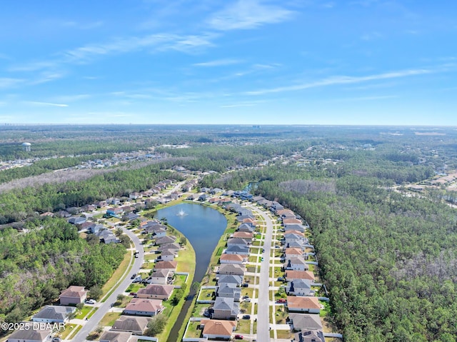 bird's eye view with a water view, a forest view, and a residential view