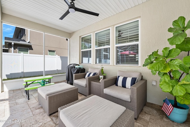 view of patio / terrace featuring outdoor lounge area, fence, and a ceiling fan