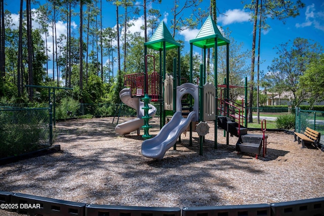 communal playground featuring fence