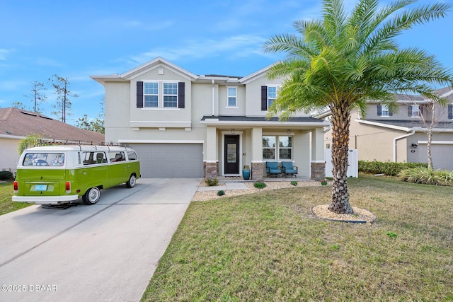 view of front facade with stucco siding, concrete driveway, an attached garage, a front yard, and stone siding