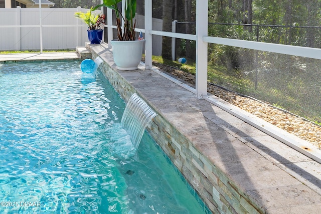 view of pool with fence and a fenced in pool