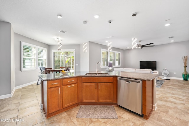 kitchen with an island with sink, brown cabinets, open floor plan, a sink, and stainless steel dishwasher