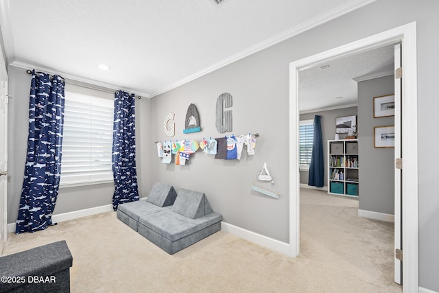 living area with carpet flooring, crown molding, a textured ceiling, and baseboards