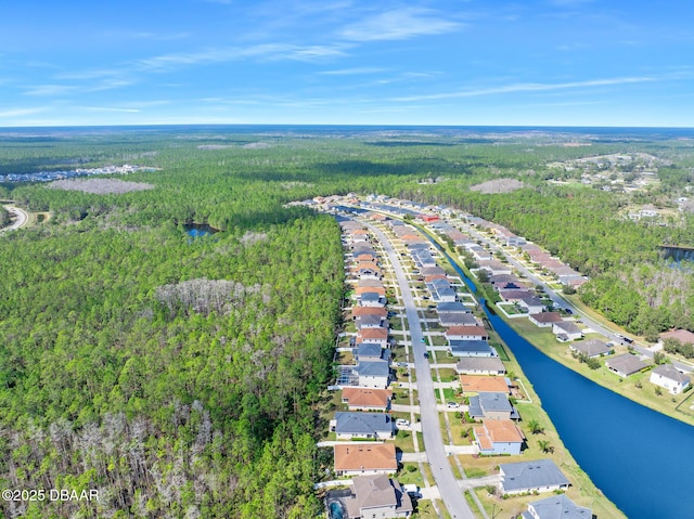 aerial view with a water view, a residential view, and a view of trees