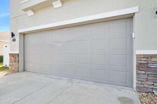 garage with concrete driveway