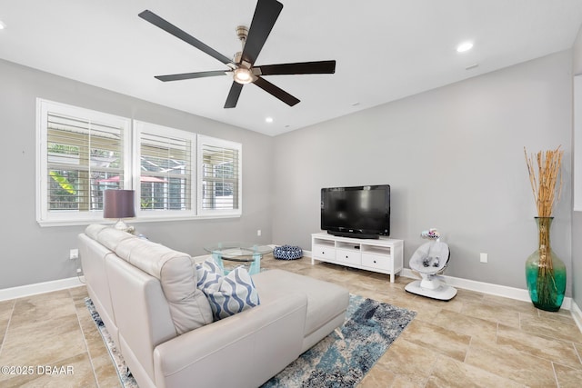 living area featuring a wealth of natural light, baseboards, and recessed lighting