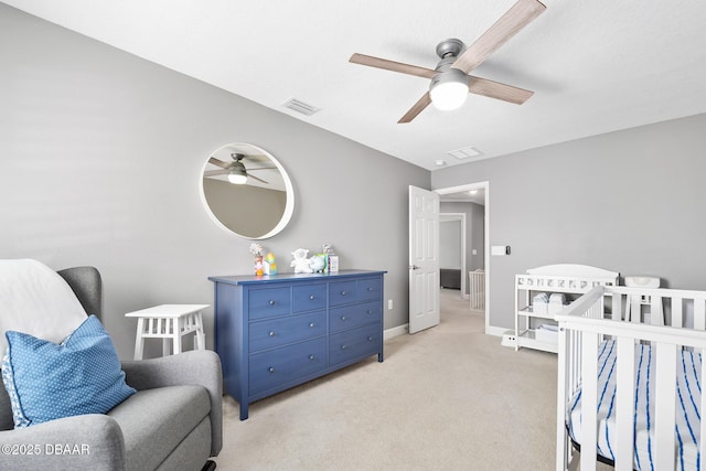 bedroom with visible vents, ceiling fan, light carpet, and baseboards