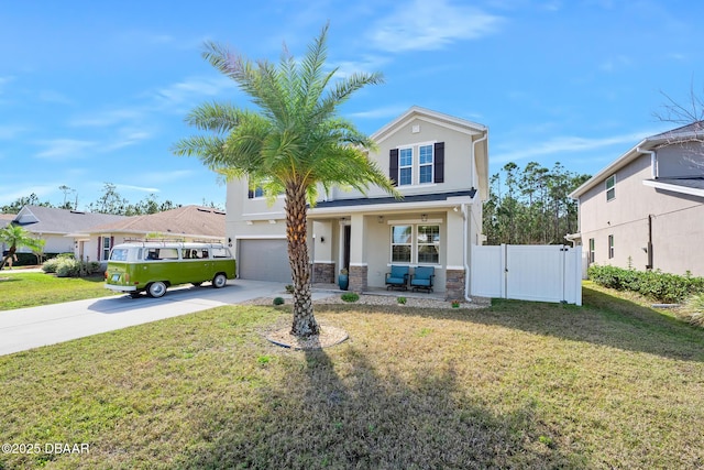 view of front of property with stucco siding, covered porch, a front yard, fence, and driveway