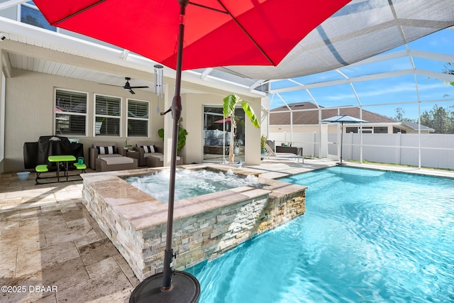 view of pool with a ceiling fan, a patio, glass enclosure, fence, and outdoor lounge area