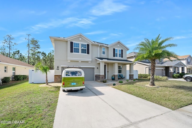 view of front of property with driveway, stone siding, an attached garage, a front lawn, and stucco siding