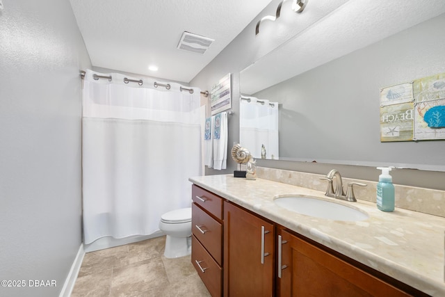 bathroom featuring toilet, vanity, visible vents, baseboards, and shower / bath combo with shower curtain