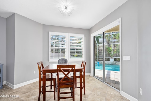 dining area featuring baseboards