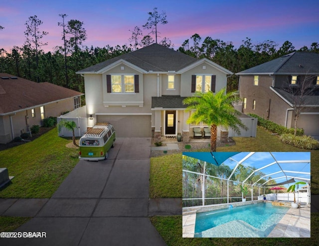 view of front of home featuring stucco siding, concrete driveway, a lawn, an attached garage, and glass enclosure