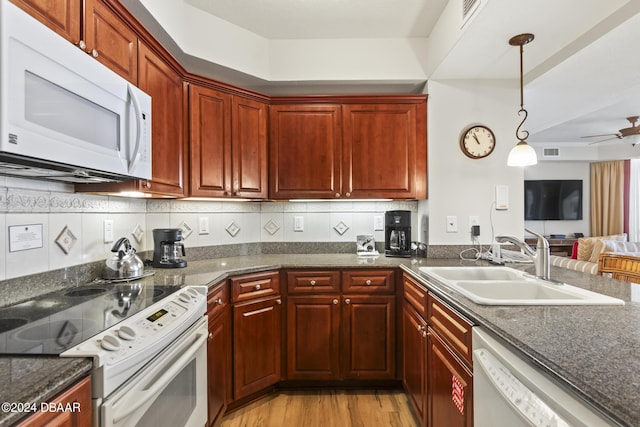 200 Ocean Crest Dr Unit 705, Palm Coast, FL 32137 - kitchen featuring white appliances, ceiling fan, light wood-style floors, open floor plan, and pendant lighting