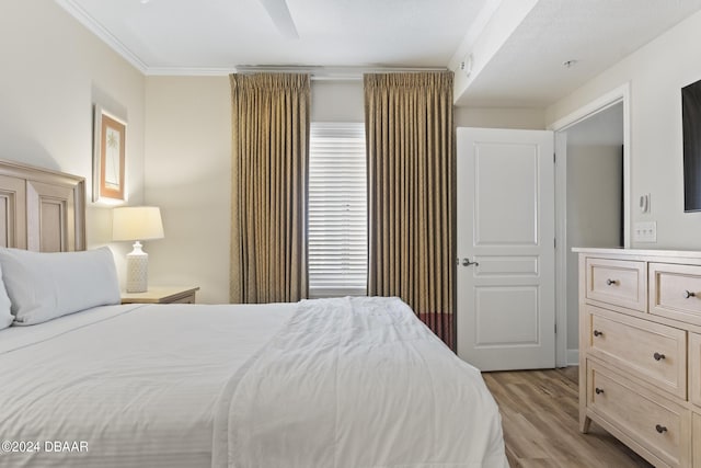 200 Ocean Crest Dr Unit 705, Palm Coast, FL 32137 - bedroom featuring light wood-style floors and ornamental molding