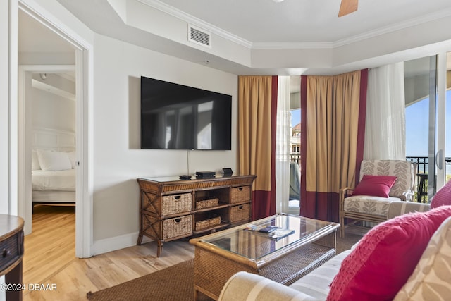 200 Ocean Crest Dr Unit 705, Palm Coast, FL 32137 - living area featuring wood finished floors, crown molding, and a ceiling fan