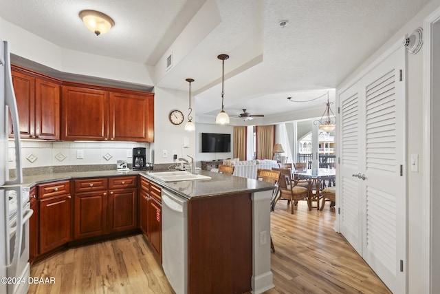 200 Ocean Crest Dr Unit 705, Palm Coast, FL 32137 - kitchen featuring a peninsula, light wood-style flooring, ceiling fan, dishwasher, and open floor plan