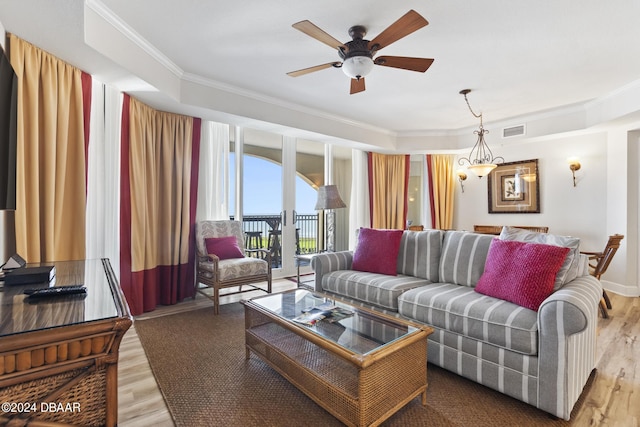 200 Ocean Crest Dr Unit 705, Palm Coast, FL 32137 - living room with ornamental molding, light wood-style flooring, and a ceiling fan