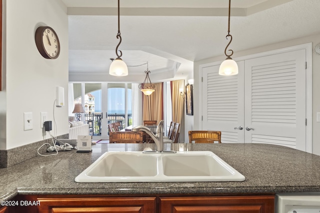 200 Ocean Crest Dr Unit 705, Palm Coast, FL 32137 - kitchen with a tray ceiling and decorative light fixtures