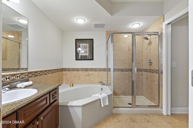 200 Ocean Crest Dr Unit 705, Palm Coast, FL 32137 - full bath featuring vanity, a bath, tile patterned floors, and a stall shower