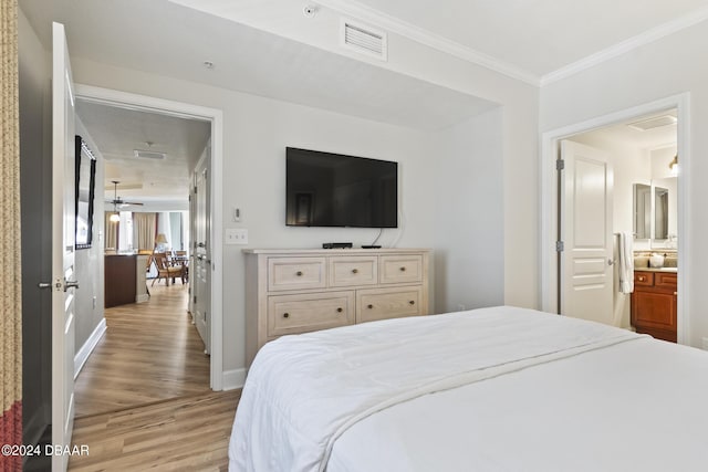 200 Ocean Crest Dr Unit 705, Palm Coast, FL 32137 - bedroom with light wood finished floors and crown molding