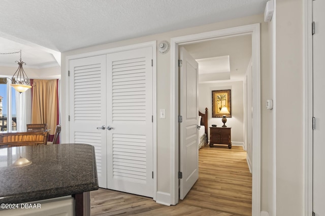200 Ocean Crest Dr Unit 705, Palm Coast, FL 32137 - hallway with light wood-style floors and a textured ceiling