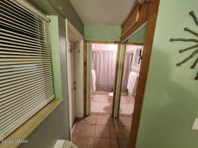 935 S Atlantic Ave Unit 223, Daytona Beach, FL 32118 - hallway featuring tile patterned flooring