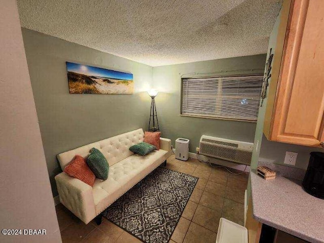 935 S Atlantic Ave Unit 223, Daytona Beach, FL 32118 - tiled living room featuring a wall mounted air conditioner and a textured ceiling