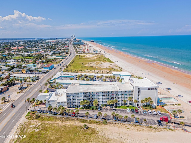 aerial view featuring a view of the beach and a water view