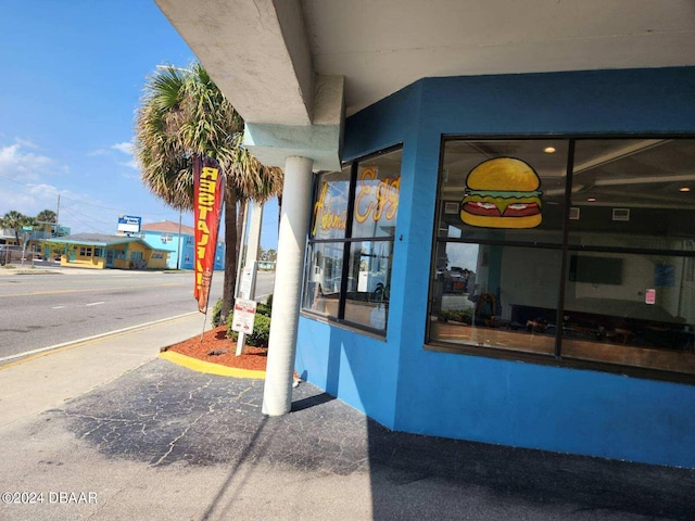 935 S Atlantic Ave Unit 223, Daytona Beach, FL 32118 - doorway to property featuring stucco siding