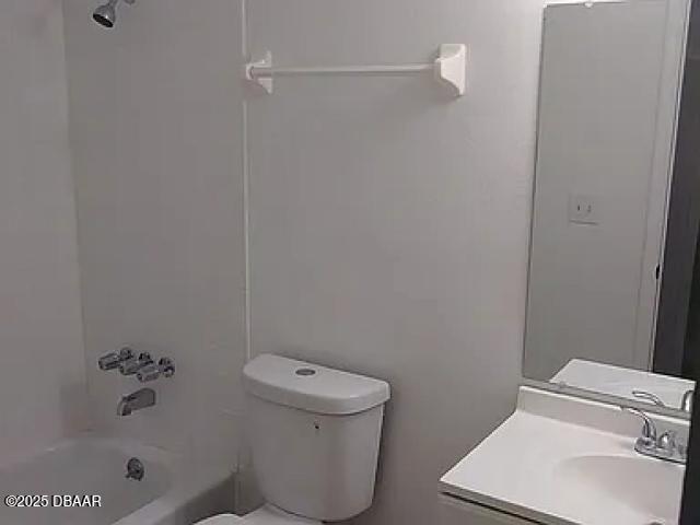 1600 Big Tree Rd Unit B3, South Daytona, FL 32119 - bathroom featuring vanity, bathtub / shower combination, and toilet