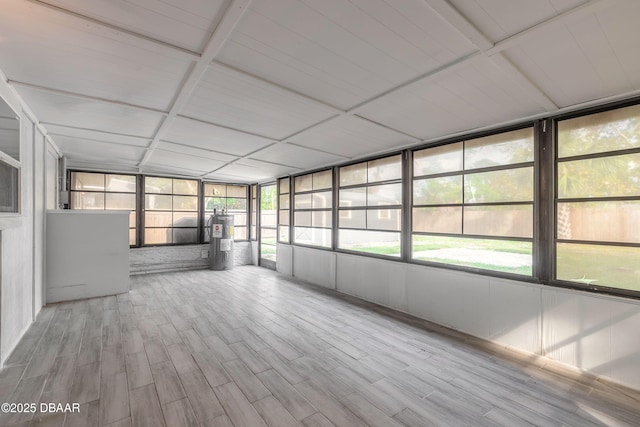 991 Dawson Dr, Deltona, FL 32725 - unfurnished sunroom featuring electric water heater and wood finished floors