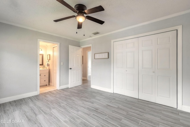 991 Dawson Dr, Deltona, FL 32725 - unfurnished bedroom with light wood-type flooring, ornamental molding, baseboards, a closet, and a ceiling fan
