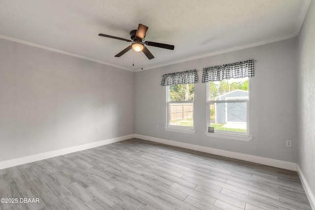 991 Dawson Dr, Deltona, FL 32725 - empty room with ceiling fan, baseboards, ornamental molding, wood finished floors, and a textured ceiling