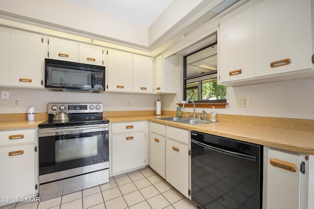 kitchen featuring light countertops, a textured ceiling, black appliances, white cabinetry, and a sink