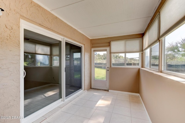 909 Northbrook Dr, Ormond Beach, FL 32174 - unfurnished sunroom featuring tile patterned floors and baseboards