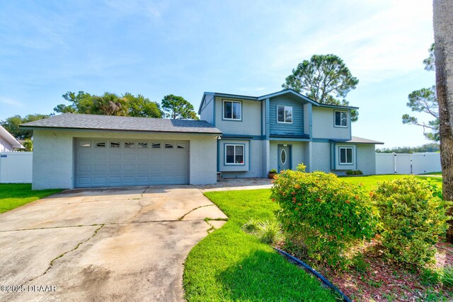 909 Northbrook Dr, Ormond Beach, FL 32174 - traditional-style house with driveway, a garage, and stucco siding