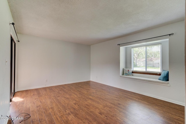 909 Northbrook Dr, Ormond Beach, FL 32174 - spare room with wood finished floors and a textured ceiling