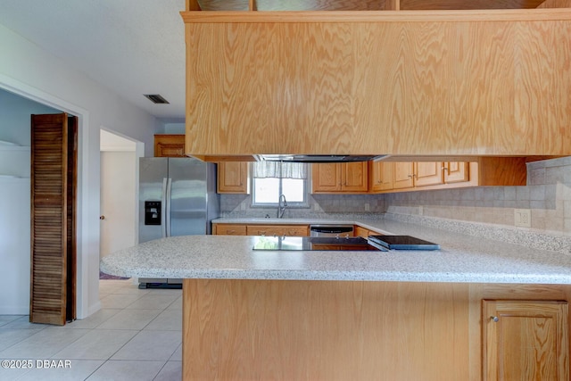 909 Northbrook Dr, Ormond Beach, FL 32174 - kitchen featuring appliances with stainless steel finishes, a peninsula, decorative backsplash, light tile patterned floors, and light stone countertops